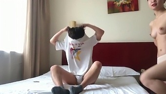 A Pair Of Chinese Lovers Share A Room In A Hotel