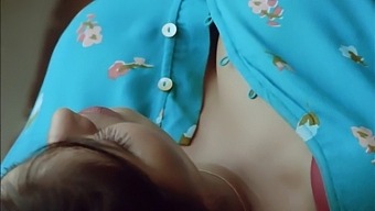 A Seductive And Attractive Older Woman Entices Her Boyfriend With Her Ample Breasts